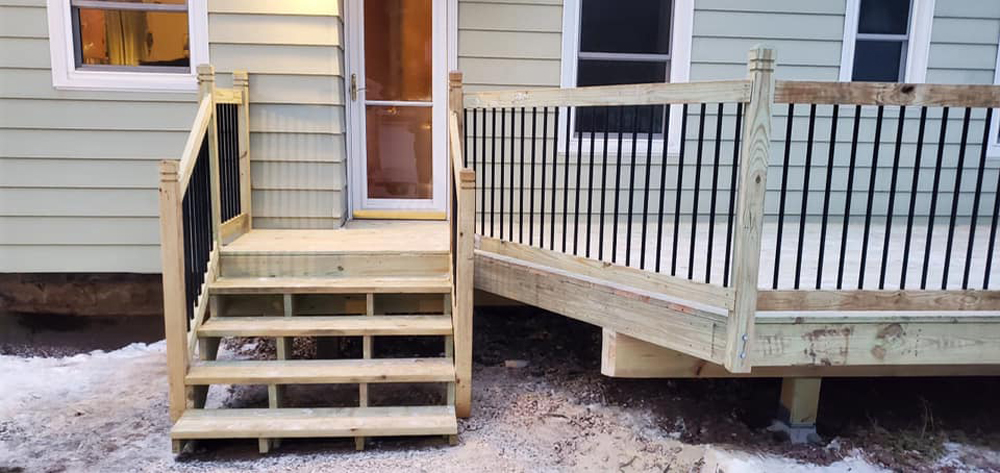 Modern home exterior featuring a custom deck build
